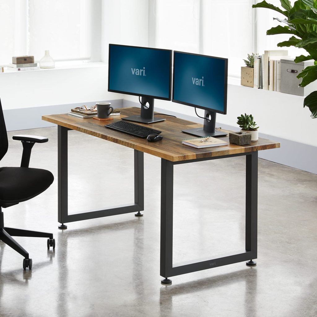 UDL ST-706 industrial computer desk with rustic wood top, black metal O-frame legs, and dual monitor setup