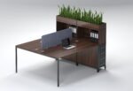 2-person office desk with dark walnut finish, charcoal storage, and blue privacy screen.