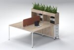 Light oak 2-person workstation with white 3-drawer units and terracotta privacy screen.